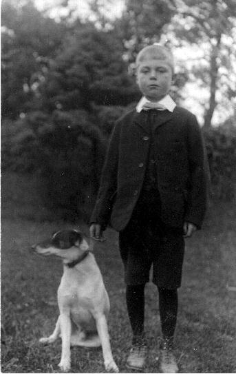 A young WILLIAM FREDERICK IVEY with family pets.