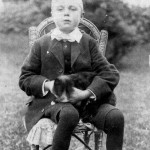 A young WILLIAM FREDERICK IVEY with family pets.